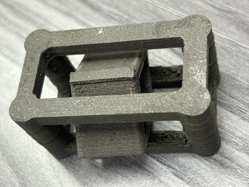 Part 3D printed with the Filamet Basalt Moon Dust filament, before sintering